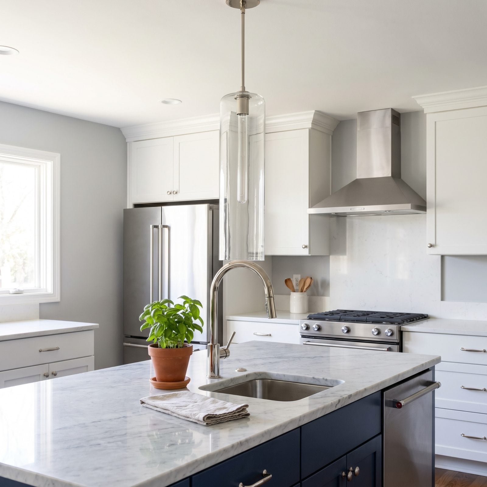 Long Pendants Crashing Into a Tall Gooseneck Faucet