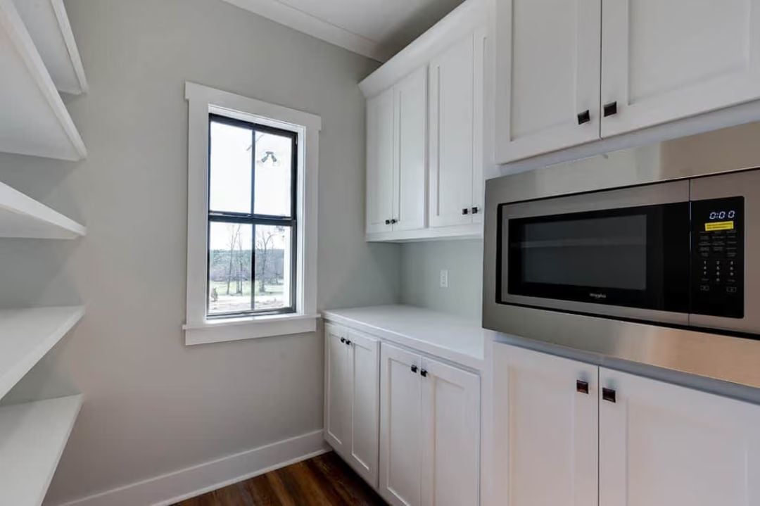 Built-In Microwave, Open Shelving, and Counter Space for the Pantry That Works Overtime
