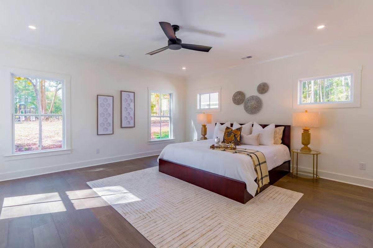 Dark Wood Floors and Woven Wall Discs Ground a Room That Could've Gone Too Minimal