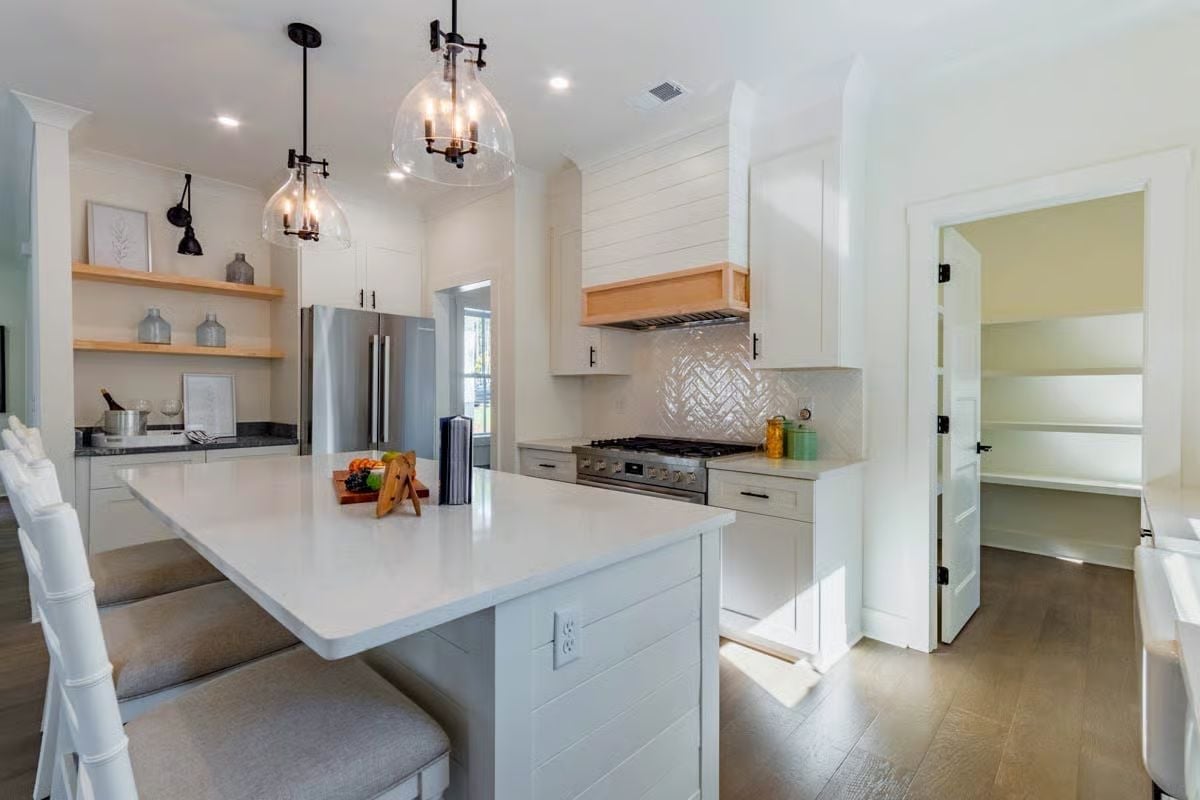 Shiplap Hood, Glass Pendants, and a Pantry Door That's Doing Real Work