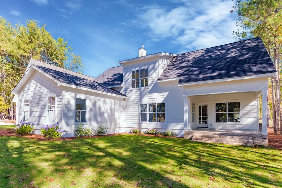 White Horizontal Siding, Dark Shingles, and a Back Porch That Earns Its Keep