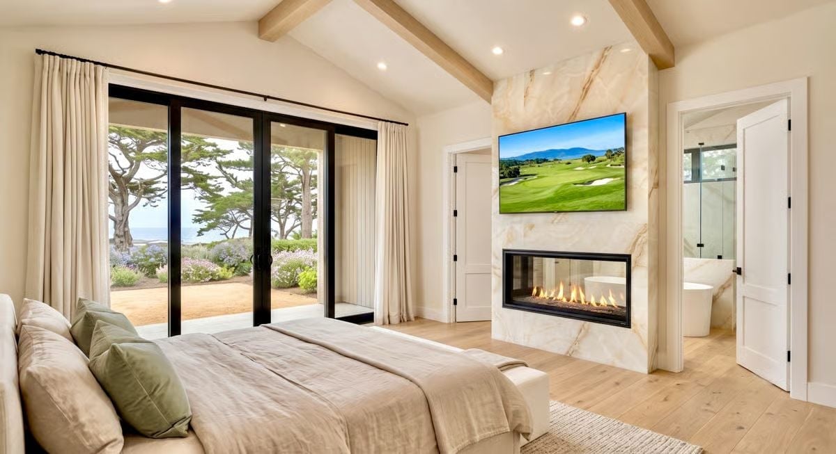 Marble Fireplace, Golf on the TV, and a Bathroom You Can See From Bed