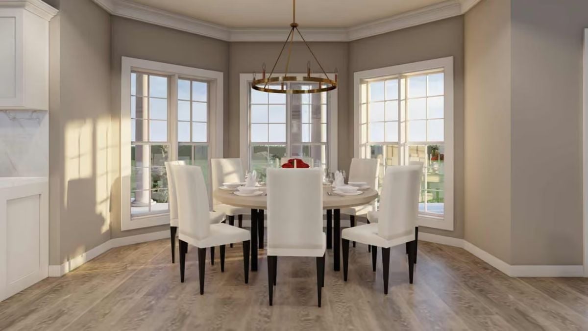 Round Table, Brass Ring Chandelier, and a Bay of Windows That Pull It All Together
