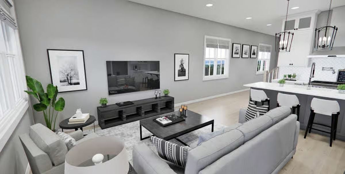 Gray Sofas, Black Coffee Table, and a Kitchen That Doesn't Hide