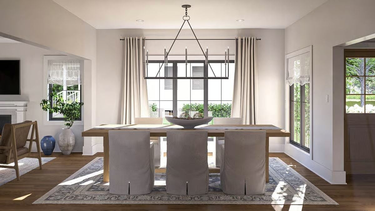 Slipcovered Chairs and a Rectangular Chandelier That Actually Earns Its Footprint