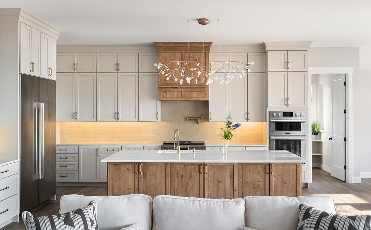 Warm Wood Island Base, Branch Chandelier, and Cabinets That Don't Try Too Hard
