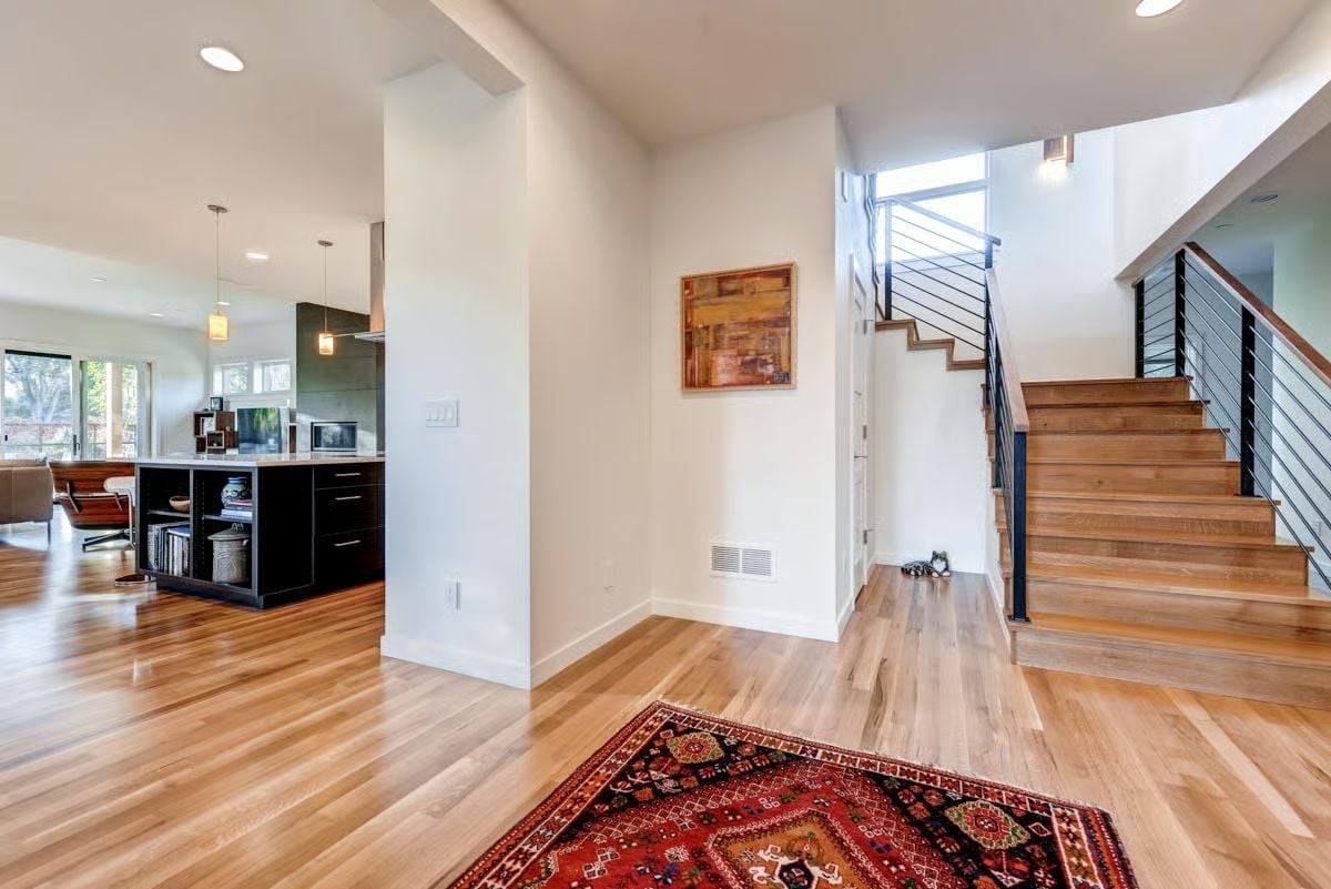 Hardwood, a Persian Rug, and Stairs That Actually Deserve the Spotlight