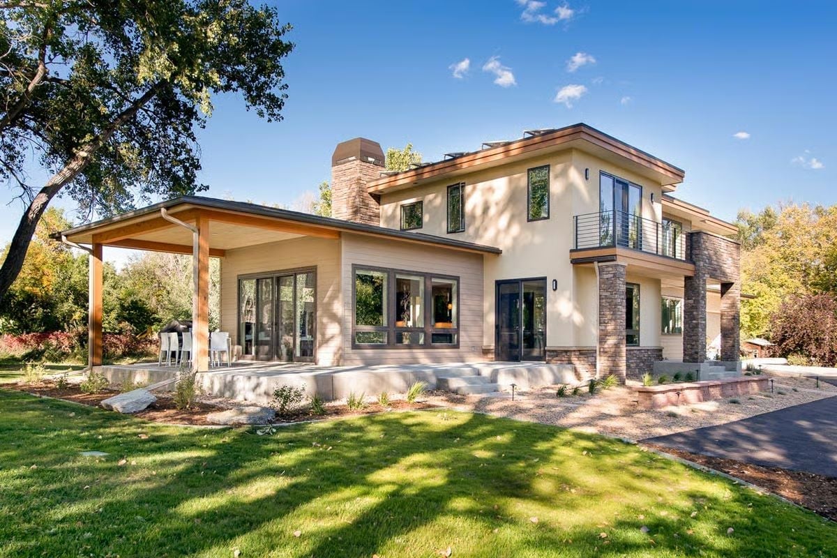 Stone, Wood, and a Covered Porch That Makes Indoor-Outdoor Actually Work