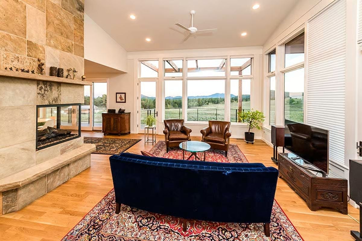 Blue Velvet Sofa Facing a View That Does All the Work