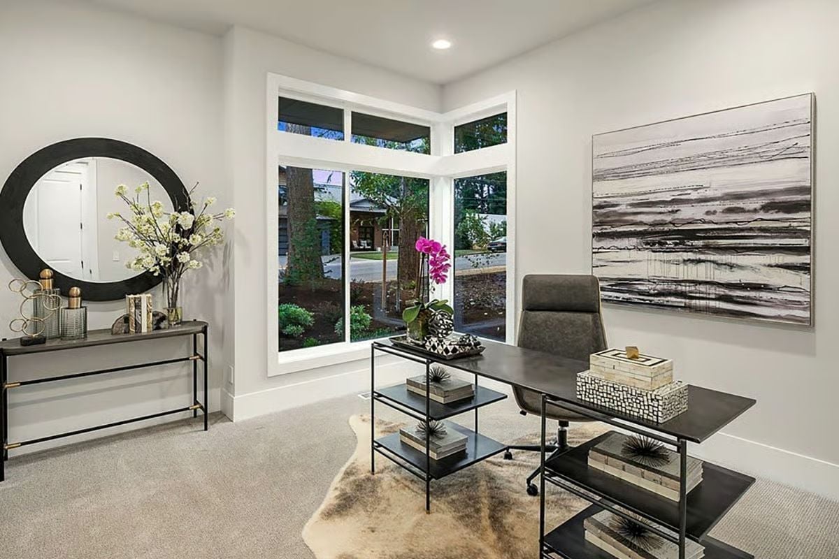 Corner Windows, Cowhide, and Abstract Art That Pulls the Room Together