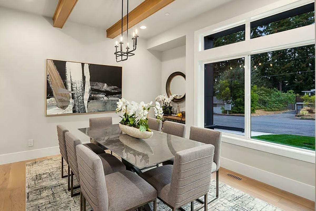 Exposed Beams, Orchids, and a Glass Table That Reflects Everything Back