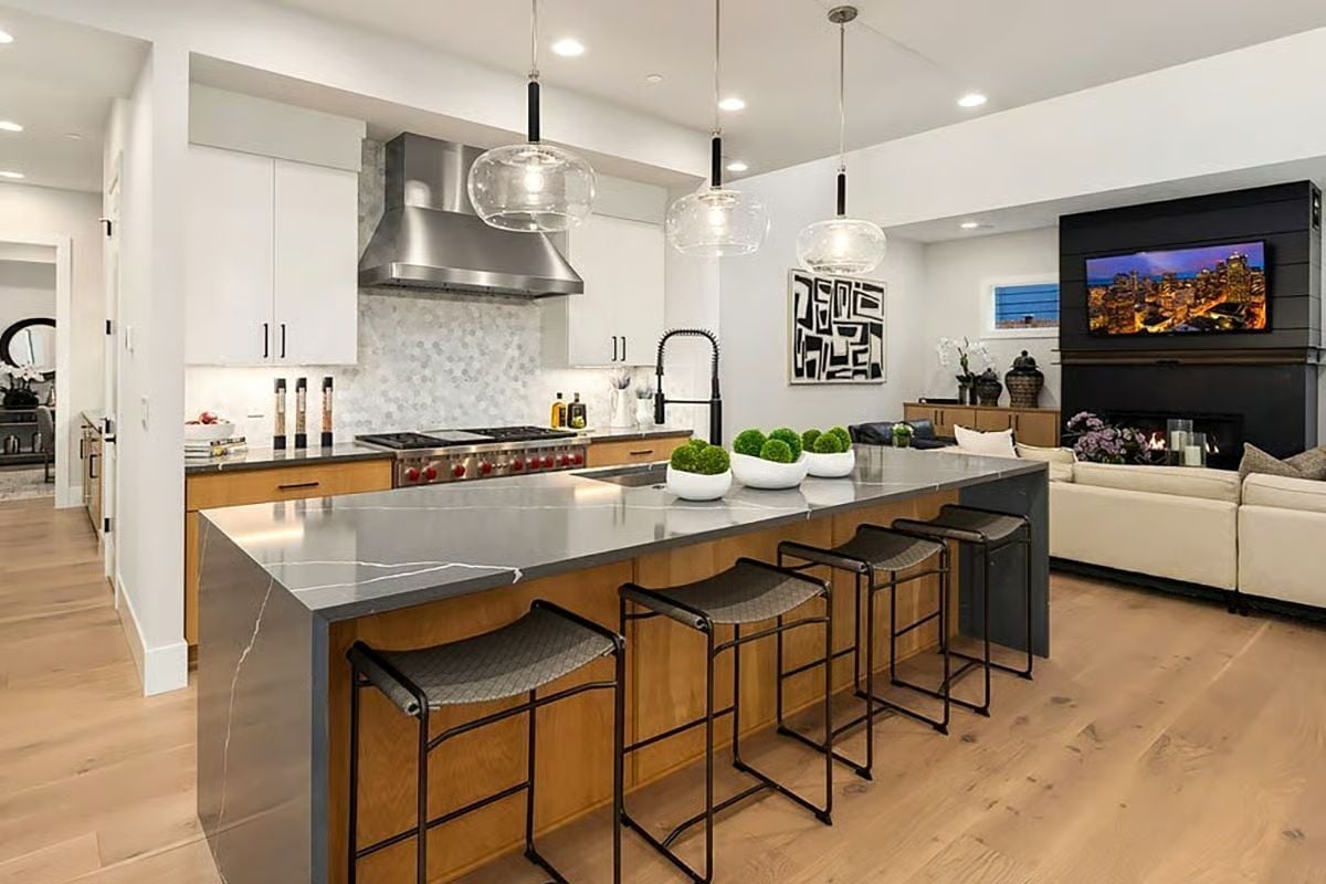Globe Pendants and a Stone Waterfall Edge That Earn Every Compliment