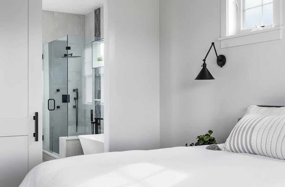 Matte Black Hardware Ties a Bedroom and Ensuite Together Without Trying Too Hard