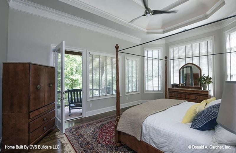 Four-Poster Frame, Tray Ceiling, and Direct Balcony Access That Makes Mornings Worth Having