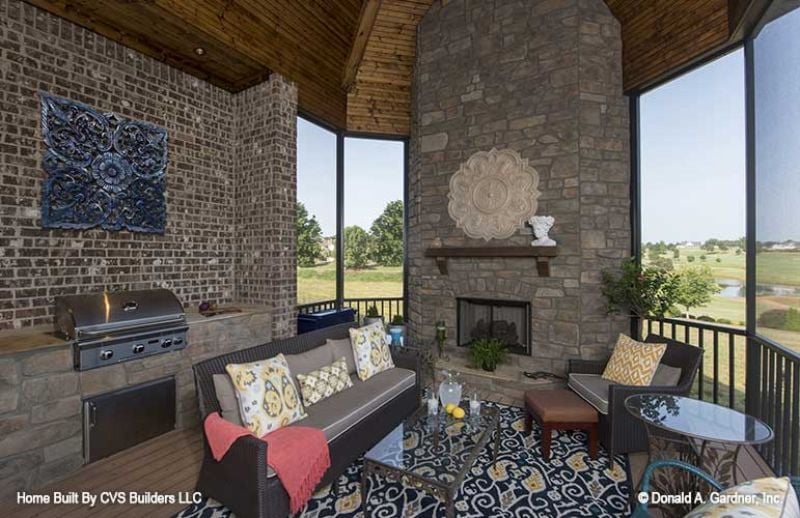 Screened Porch with a Stone Fireplace That Earns Its Square Footage Year-Round