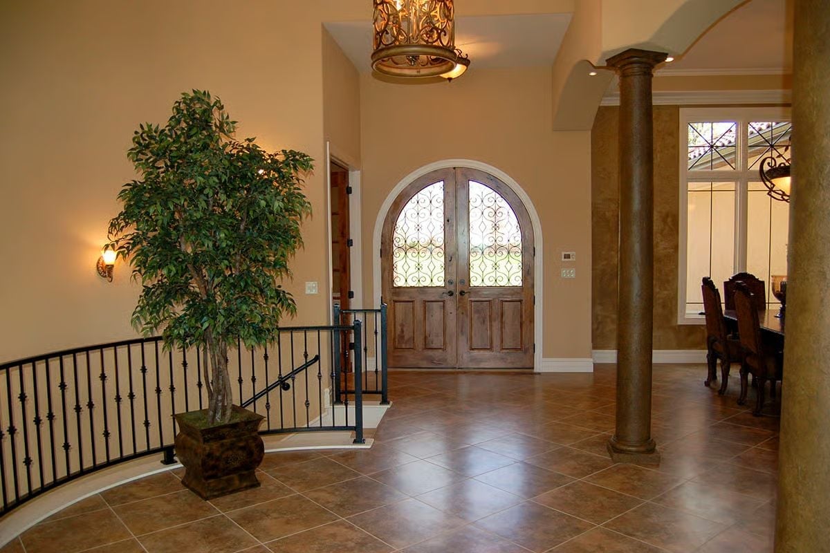 Arched Iron-Grille Doors That Make Every Arrival Feel Like an Event