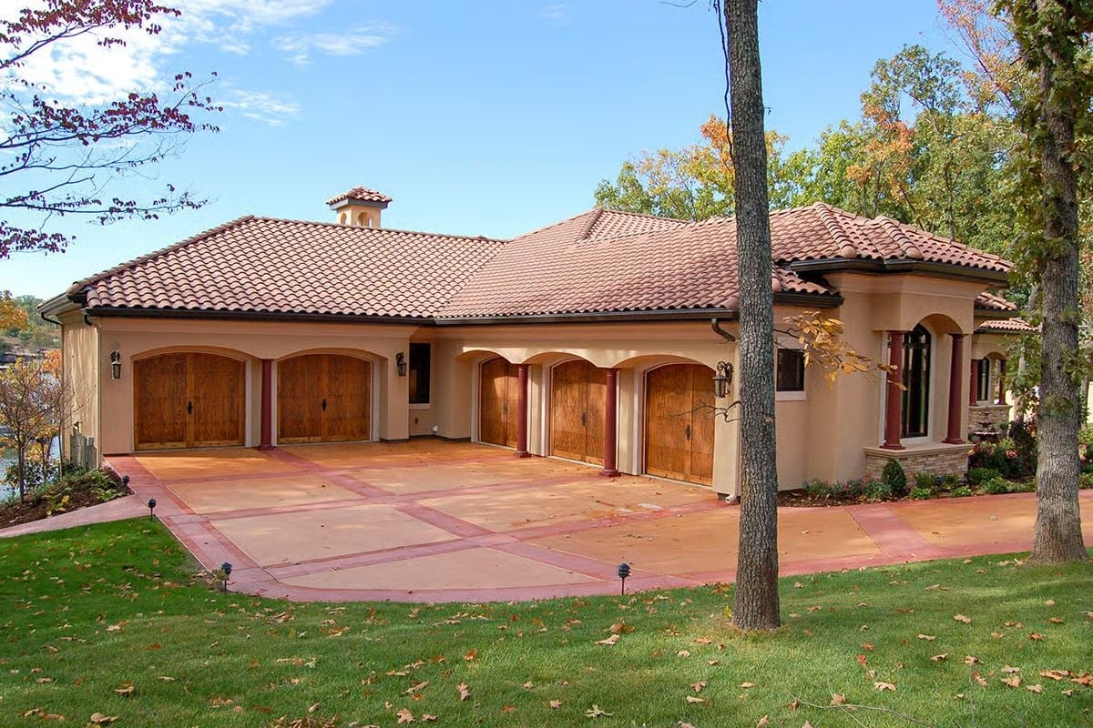 Four Wood Garage Doors and a Terracotta Roof That Mean Business