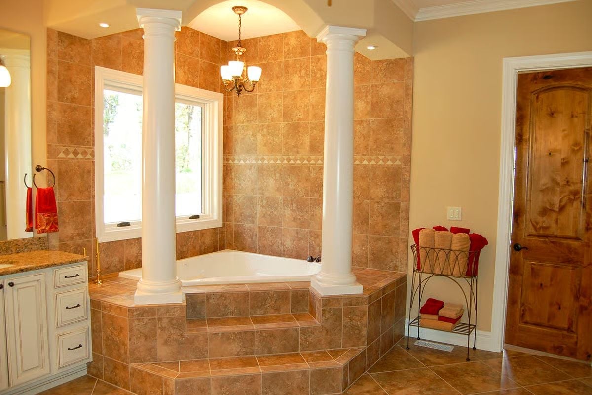 Roman Columns Around a Corner Soaker Tub Nobody Wants to Leave