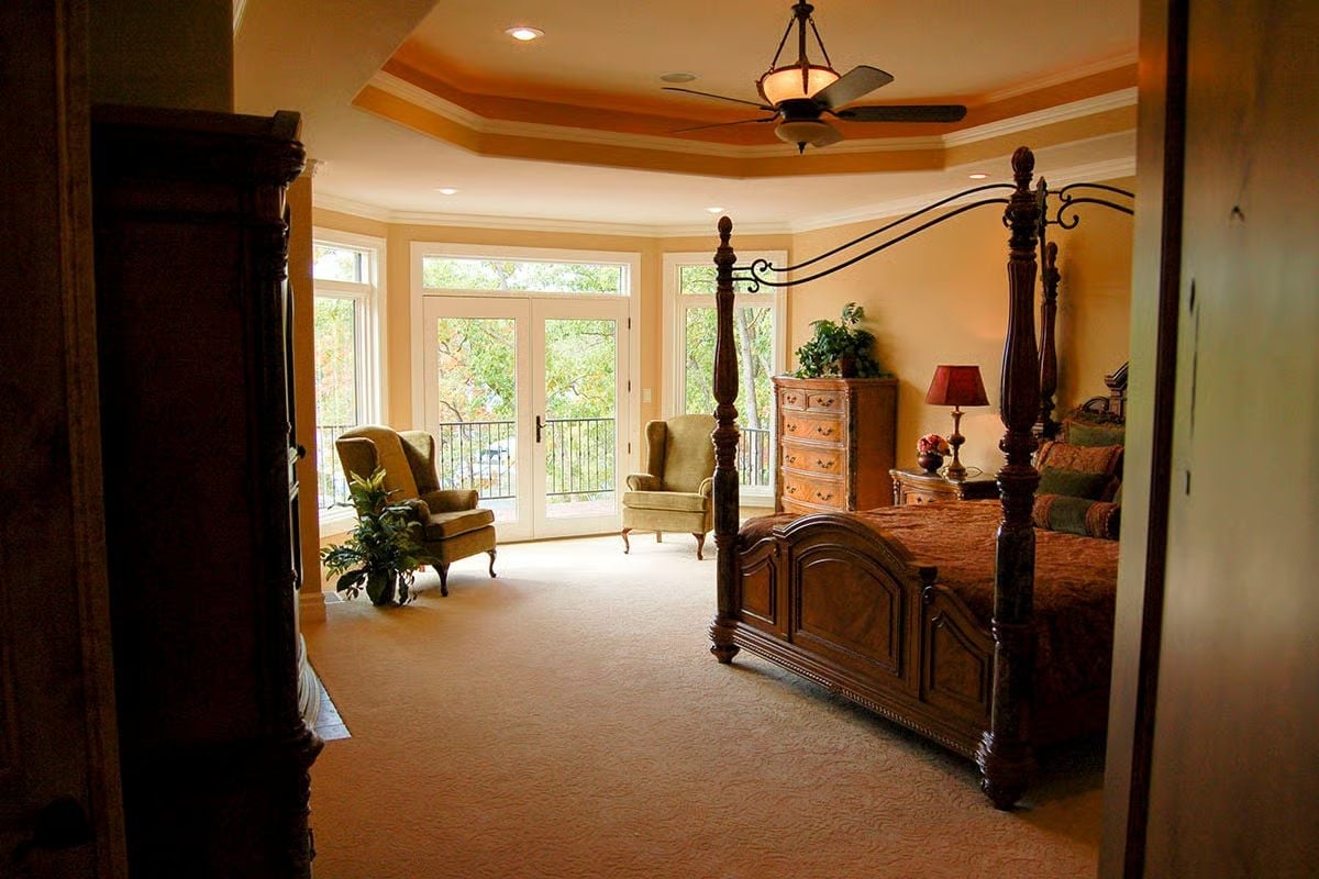 Tray Ceiling Painted Warm Amber Above a Four-Poster Bed Built to Last Generations