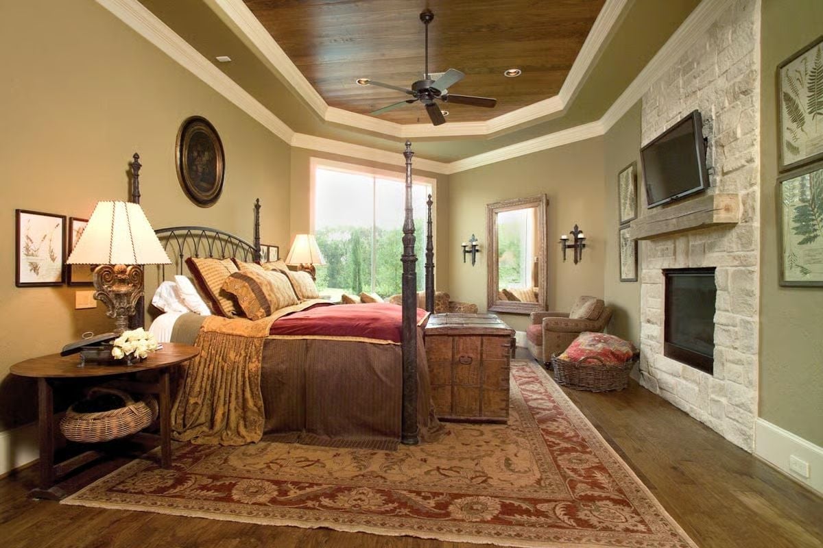 Four-Poster Grandeur Beside a Stone Fireplace Built to Last Generations