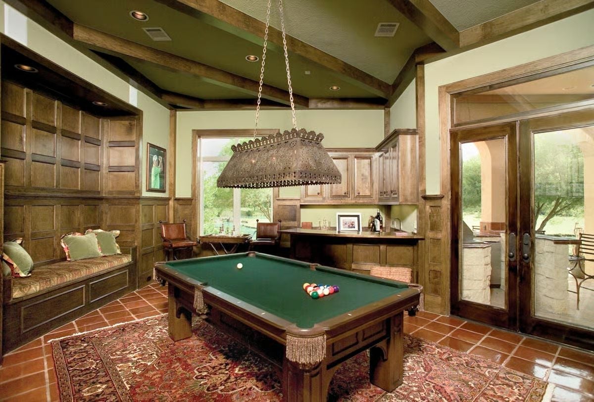 Ornate Billiard Room Where Wainscoting and Vaulted Beams Do the Heavy Lifting