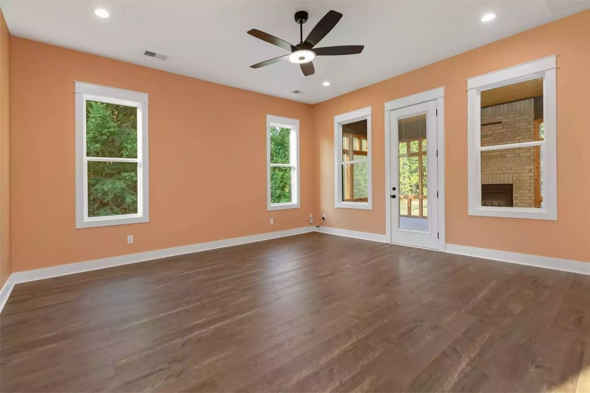 Peach Walls and Dark Hardwood Prove Warm Tones Don't Need to Play It Safe