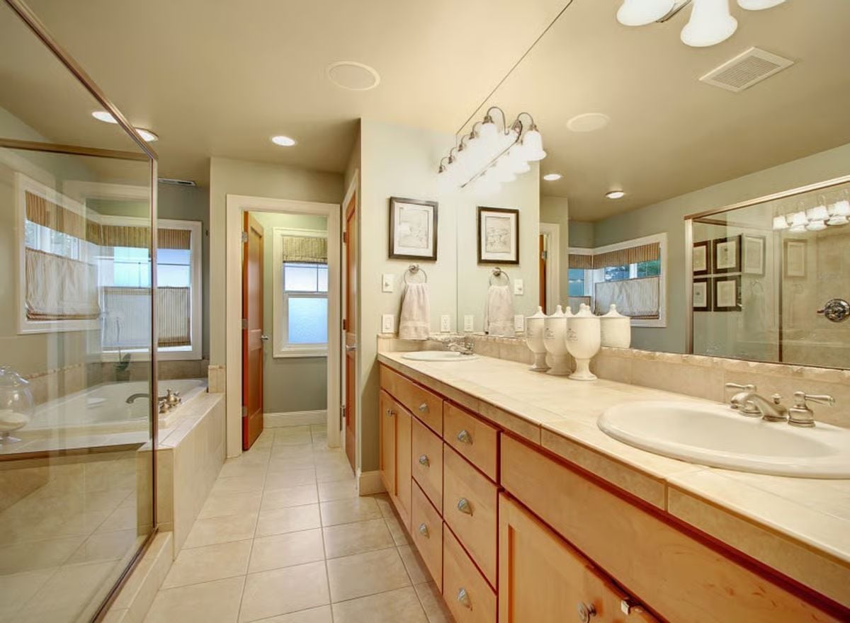 Double Vanity With Marble Counters That Earns Its Square Footage