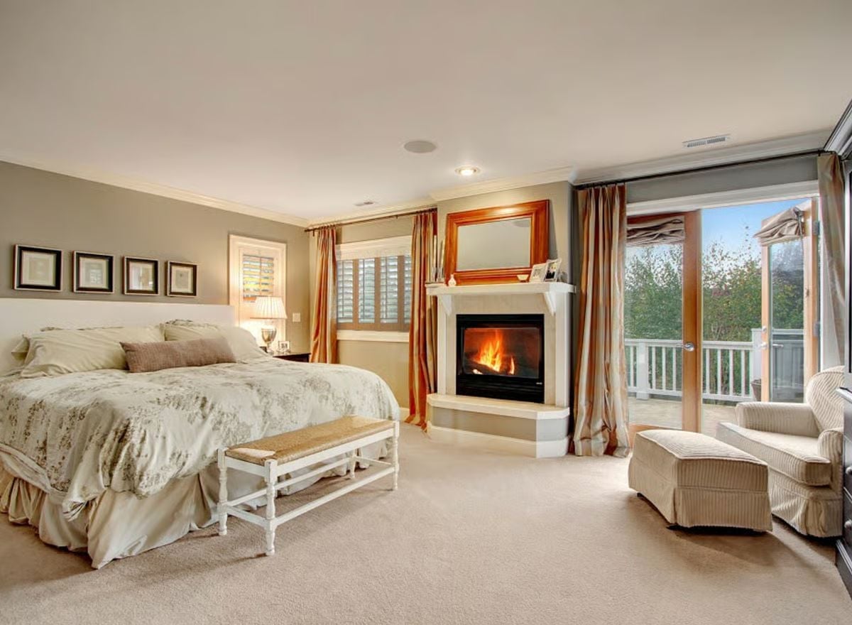 Fireplace in the Corner, Balcony Through the Glass — Master Suite Goals