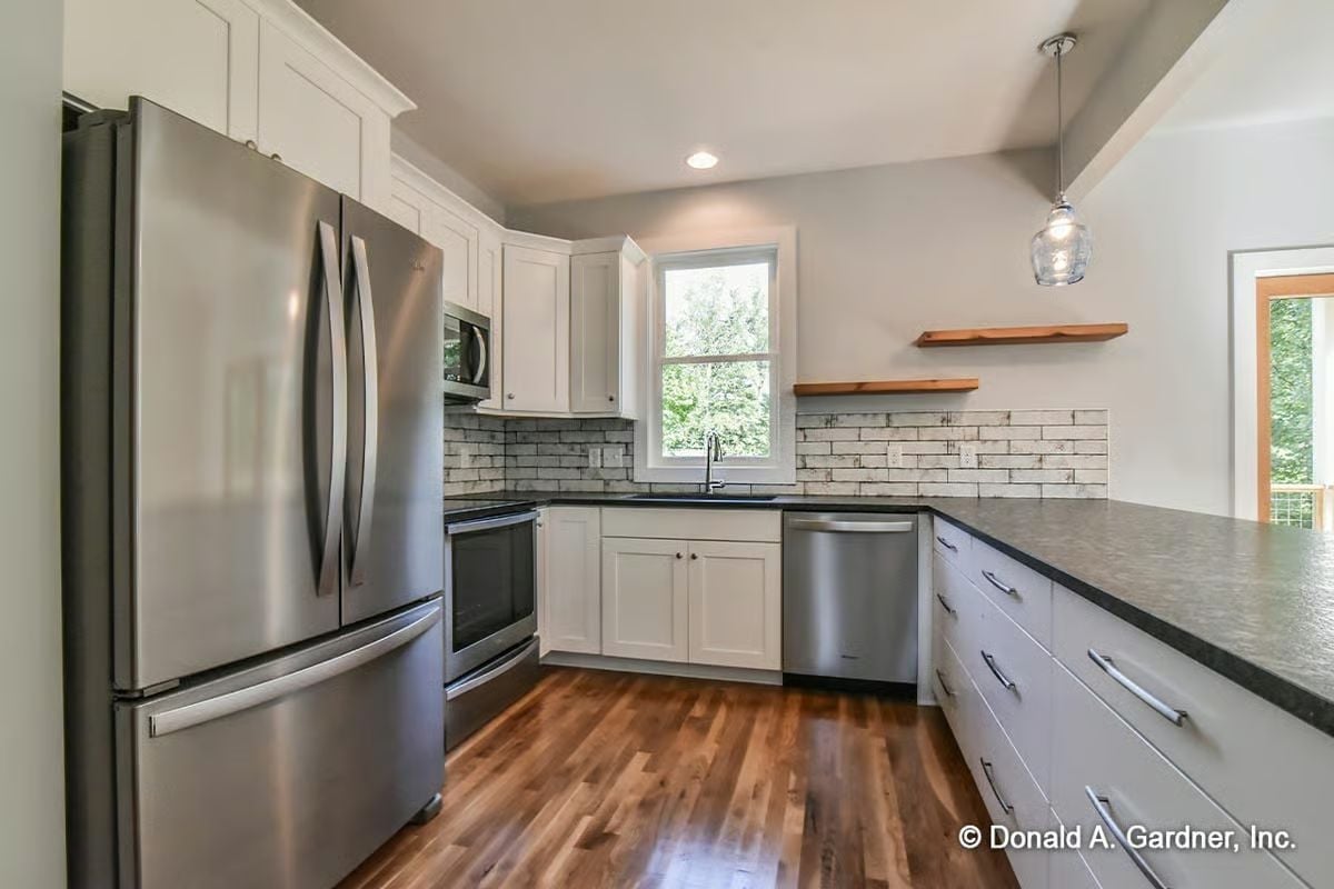 Stainless Appliances and a Brick Backsplash Keep This Kitchen Honest