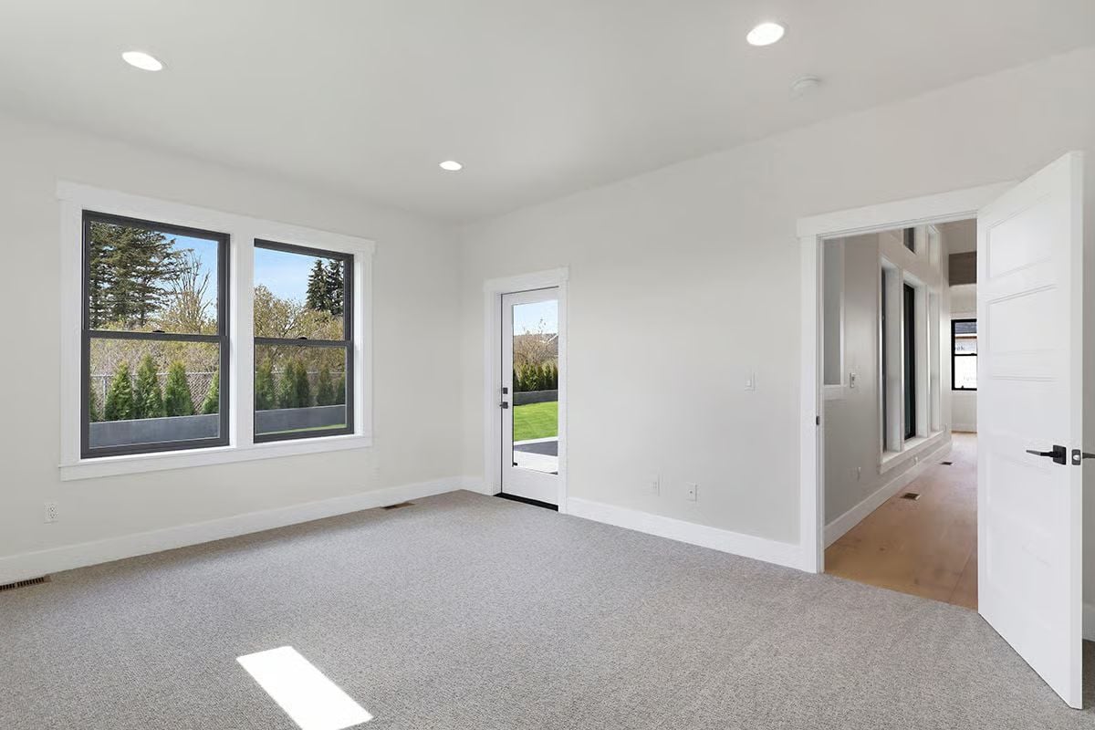 Carpet, Recessed Lights, and a Door That Opens Straight to the Yard
