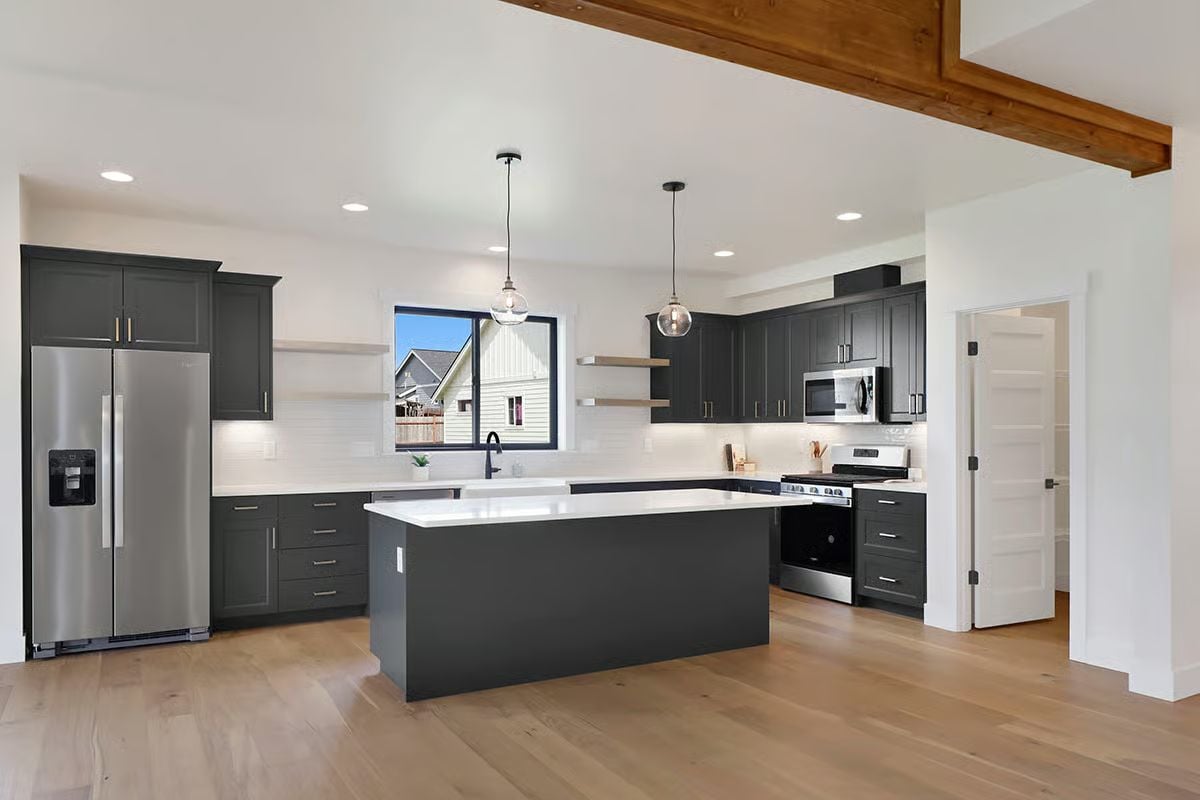 Charcoal Cabinets and a White Quartz Island That Pull the Room Into Focus