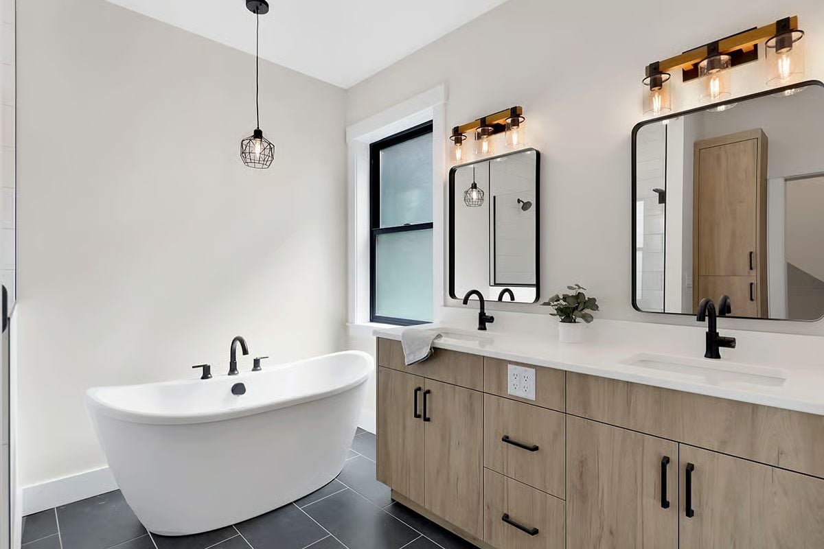 Matte Black Fixtures Against Warm Wood Grain Do the Heavy Lifting Here