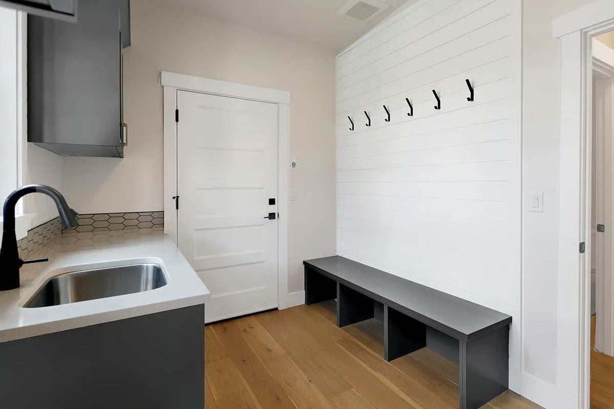Mudroom Sink and Shiplap Hooks Doing Exactly What a Side Entry Should Do