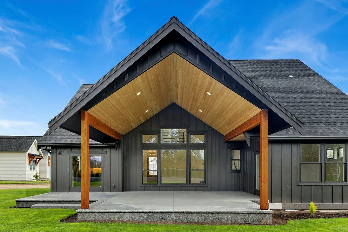 Warm Cedar Posts Under a Charcoal Gable That Actually Earns the Drama