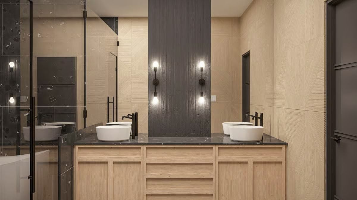 Vessel Sinks, Black Marble, and Wall Sconces Doing the Real Work Here
