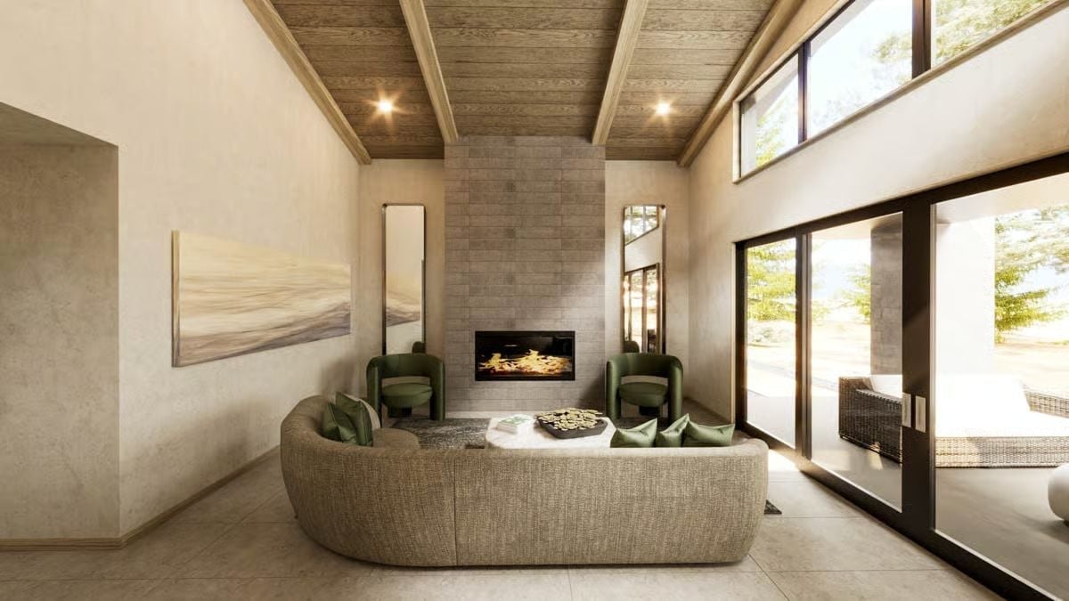 Stone Surround, Green Velvet Chairs, and a Sofa That Curves Like It Means It