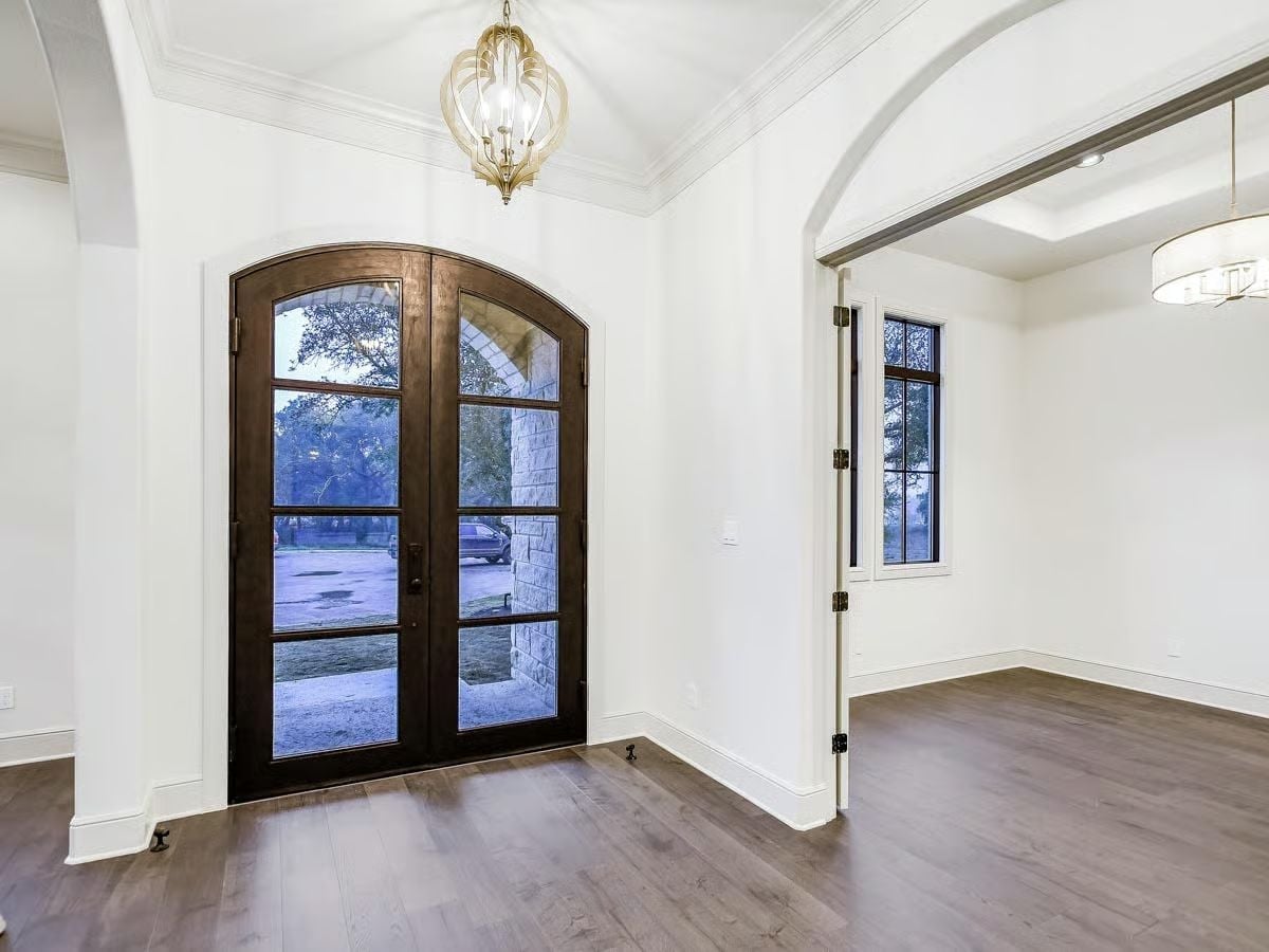 Arched Iron-and-Glass Entry Doors That Mean Business