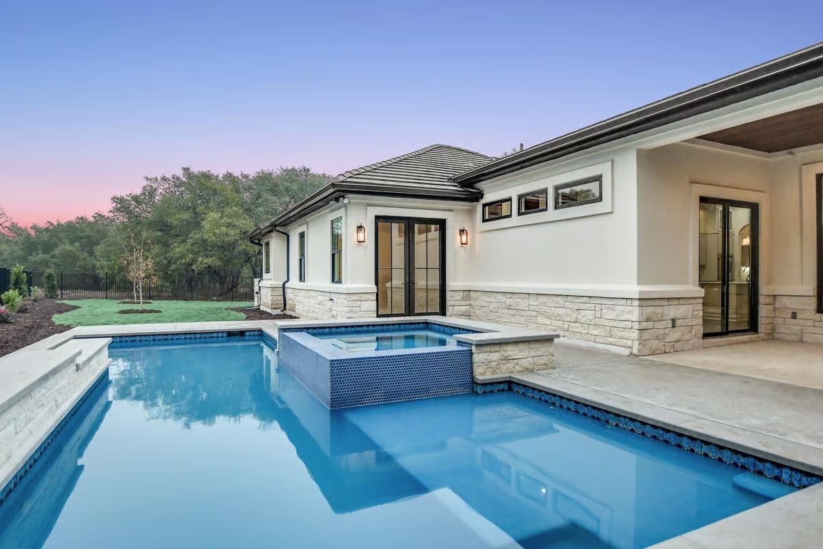 Blue Tile Spa Shell and a Pool Deck Built for Dusk