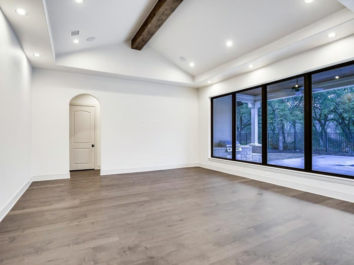 Exposed Beam Ceiling, Black-Framed Glass, and Room to Actually Breathe