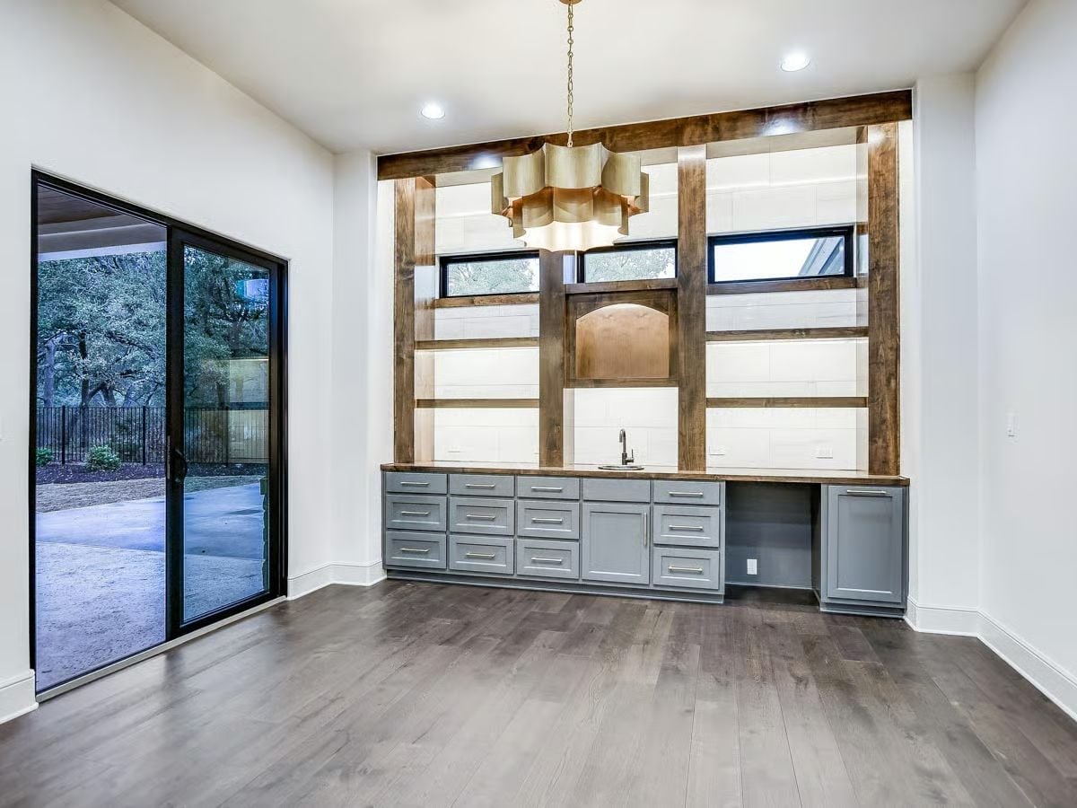 Reclaimed Wood Shelving Wall With a Butler's Pantry Built to Pull Its Weight