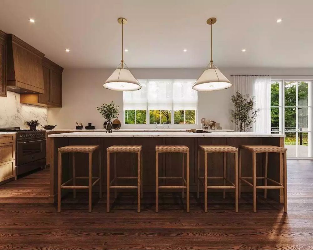 Woven Barstools and Brass Pendants Doing the Heavy Lifting in a Dark Island Kitchen