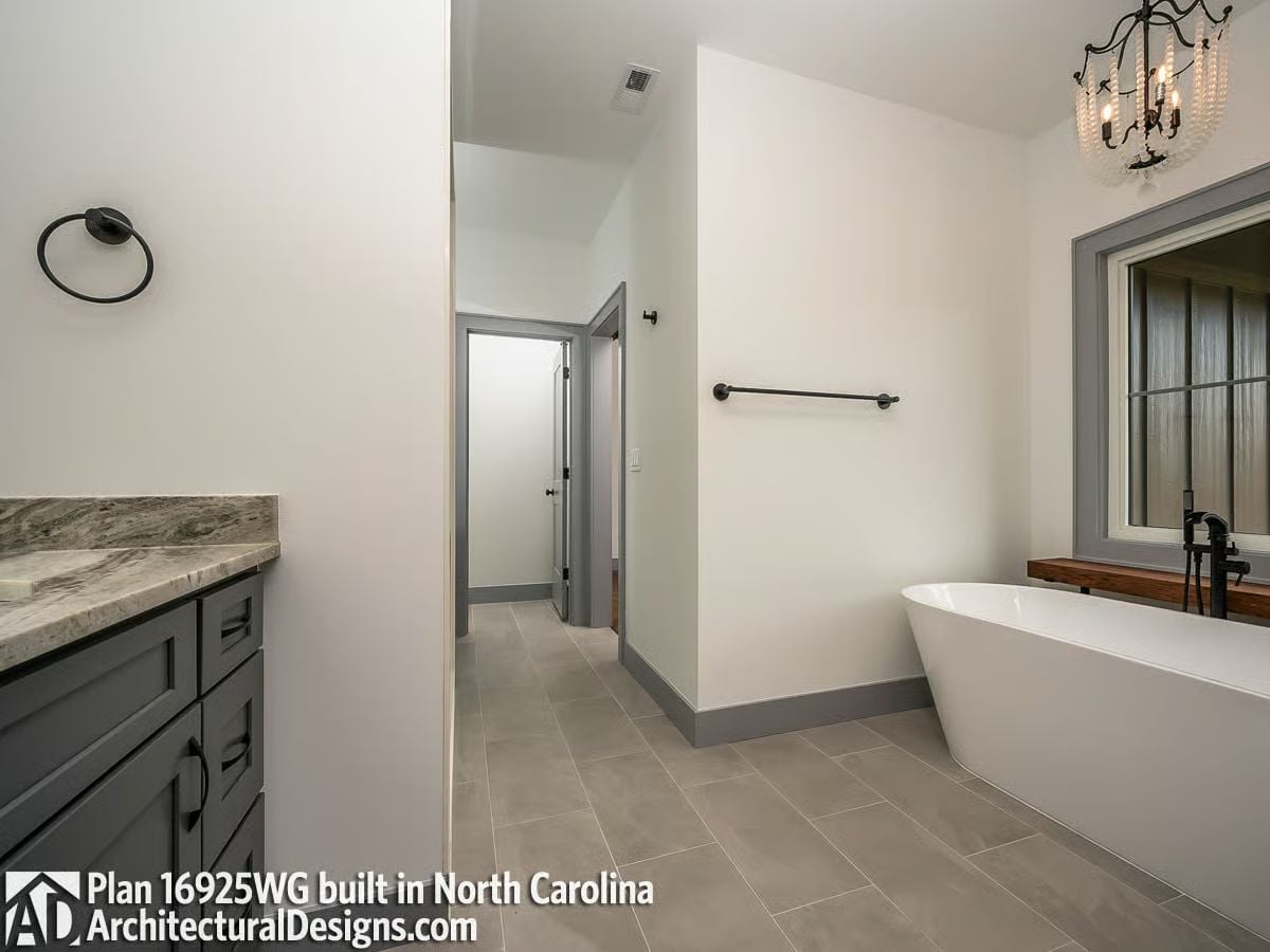 Freestanding Tub, Chandelier, and a Frosted Glass Door Worth Stealing