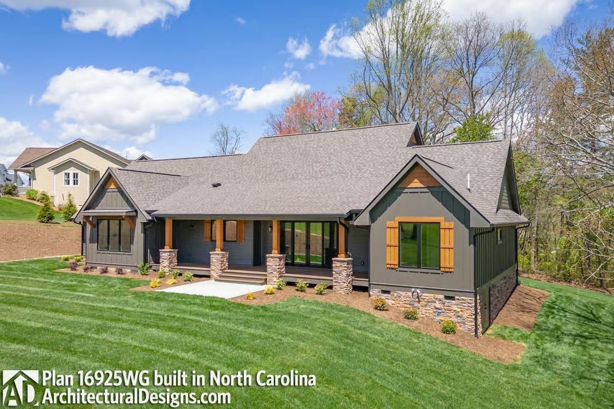 Stone Columns, Wood Shutters, and a Covered Porch Built for Slowing Down
