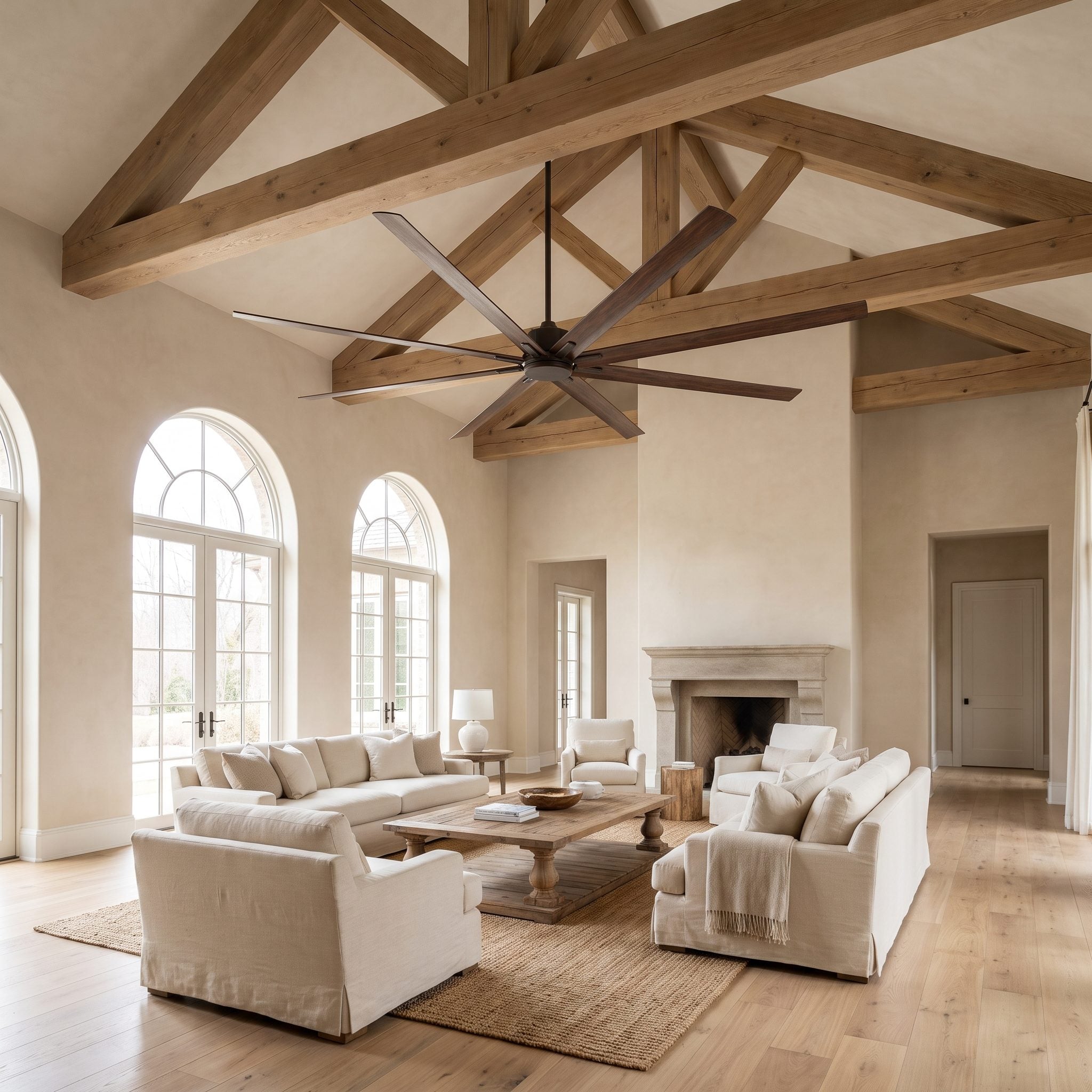Great room with a vaulted ceiling and a 72-inch six-blade fan on a downrod hanging above an 84-inch sofa.