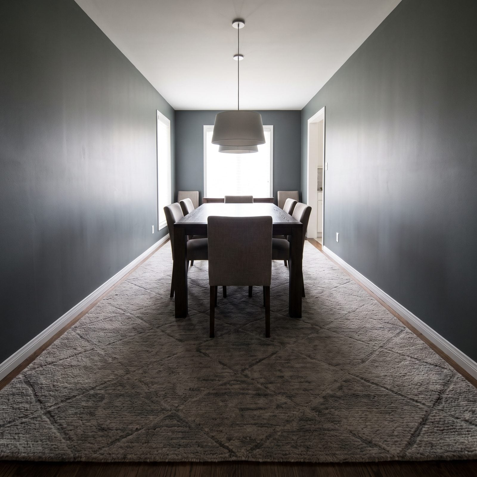 The Oversized Rug That Swallows a Narrow Dining Room
