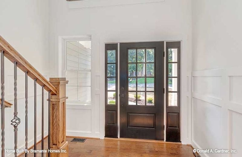 Dark Front Door, Tall Ceilings, and a Staircase Worth Noticing