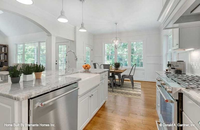 Farmhouse Sink, Marble Counters, and Pendant Lights That Know Their Job