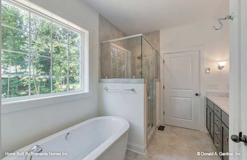 Freestanding Tub, Glass Shower, and a Window That Earns Its Keep