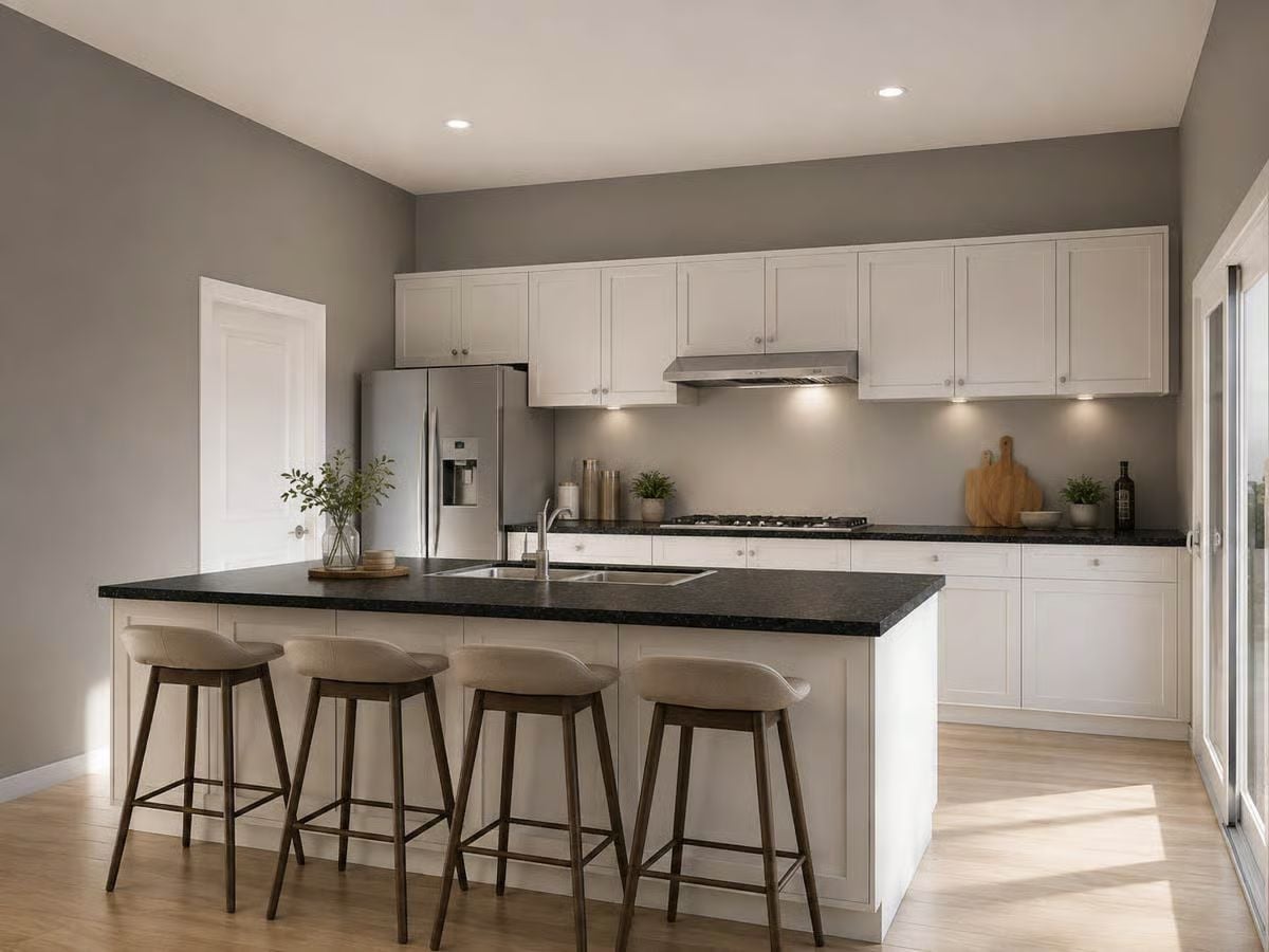 Dark Granite Island With Four Seats and a Sink That Actually Gets Used