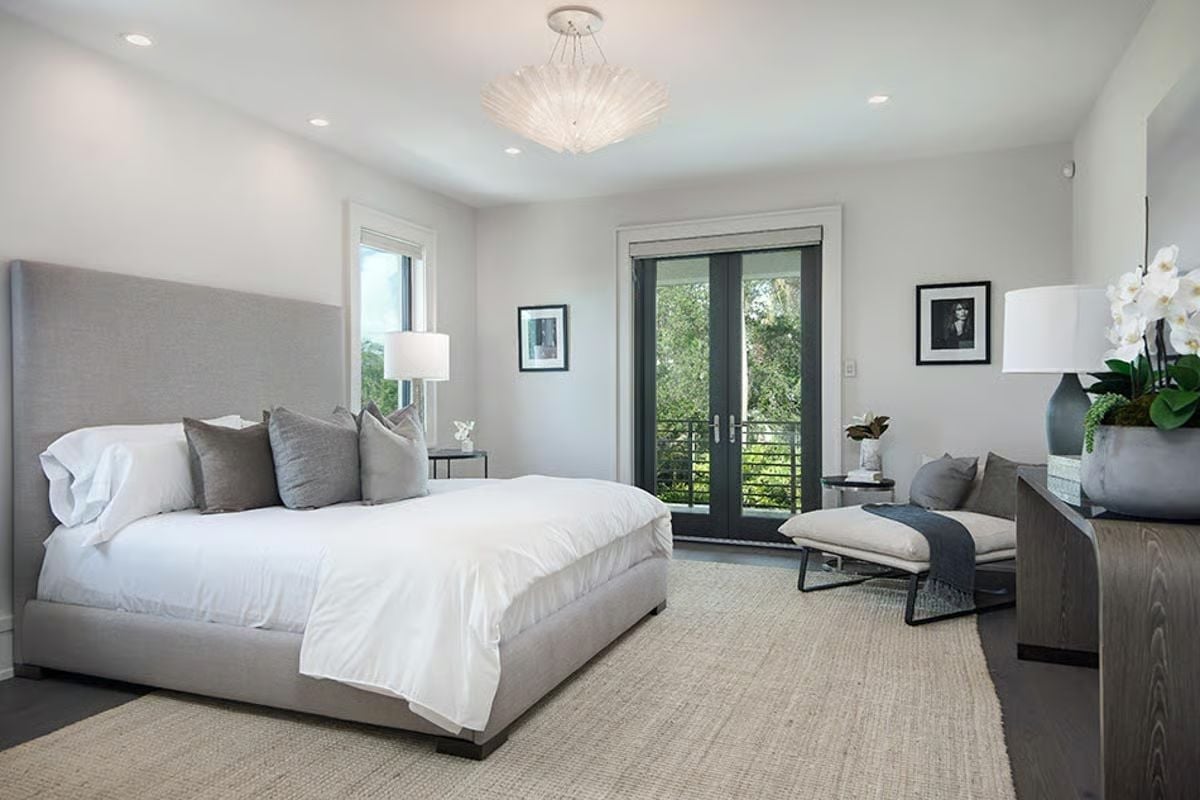 Gray Upholstered Headboard Tall Enough to Anchor the Whole Wall